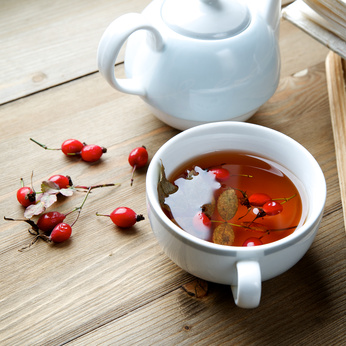 Rosehip tea with books in the background