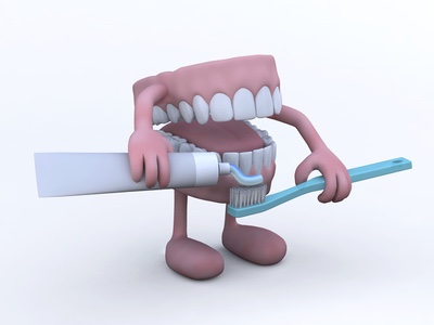 open denture with toothpaste tube and toothbrush